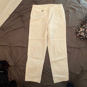 White slightly worn stretchy crop pants. Waistline goes in to fit snug.